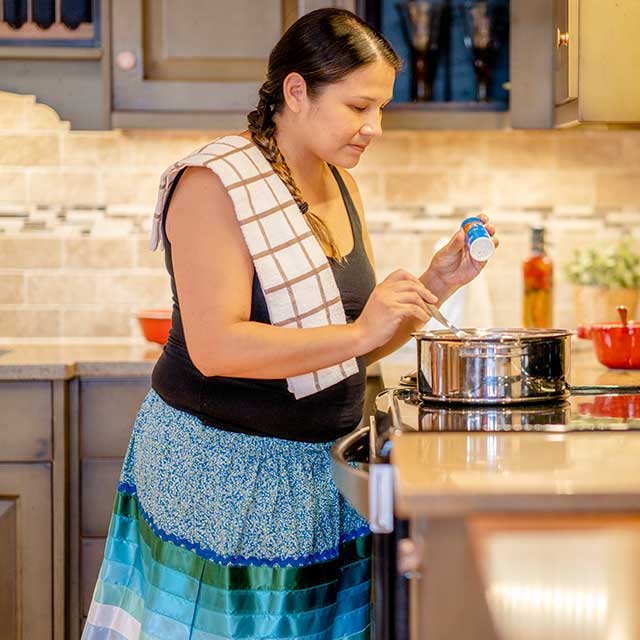 Woman cooking in kitchen