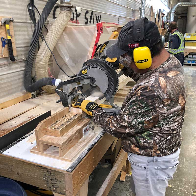 person using a power saw